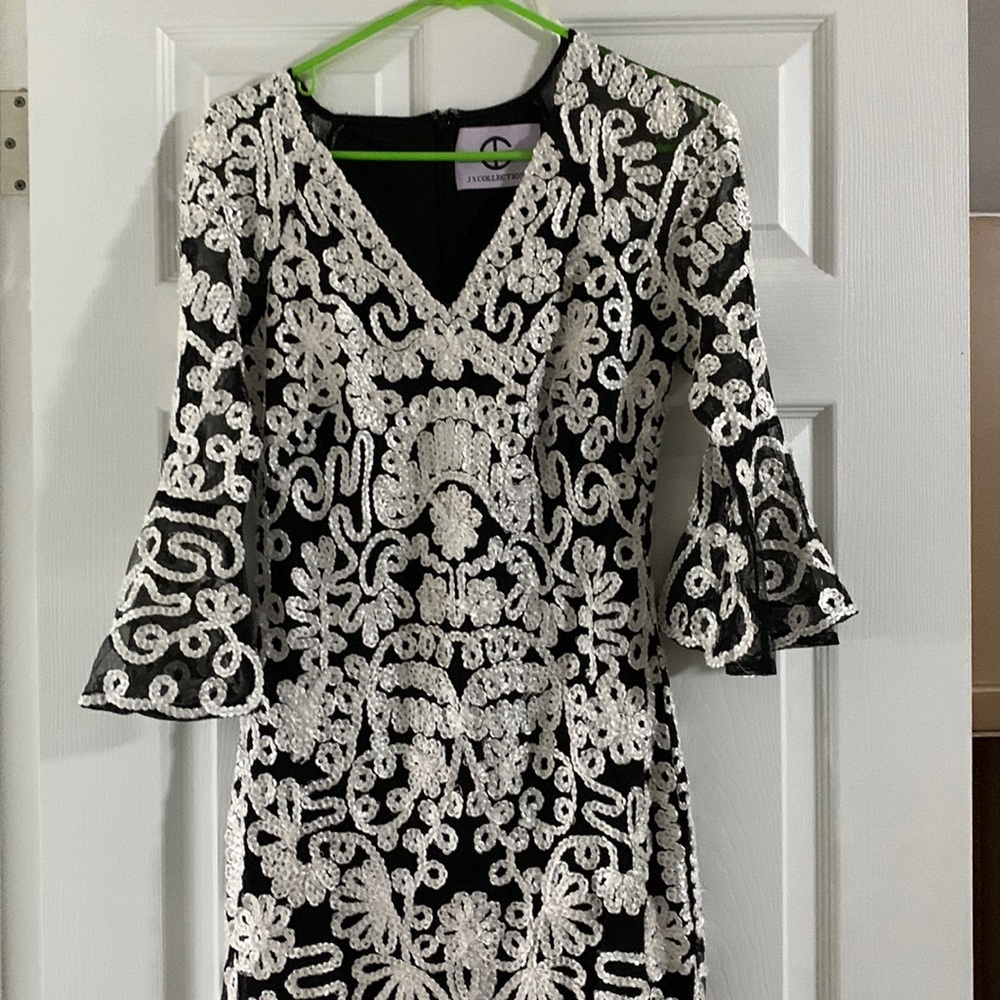 Black and white unique dress size 6. 3/4 sleeves made by Jan collections